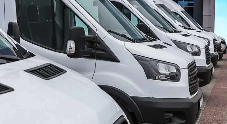 row-of-white-courier-vans-